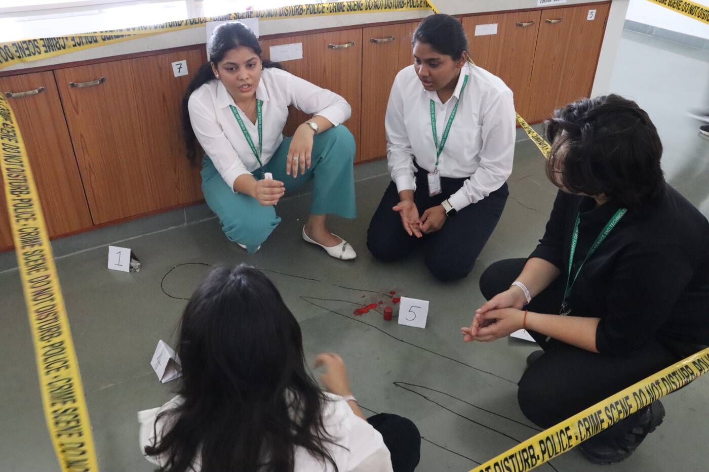 Participants examining a simulated crime scene